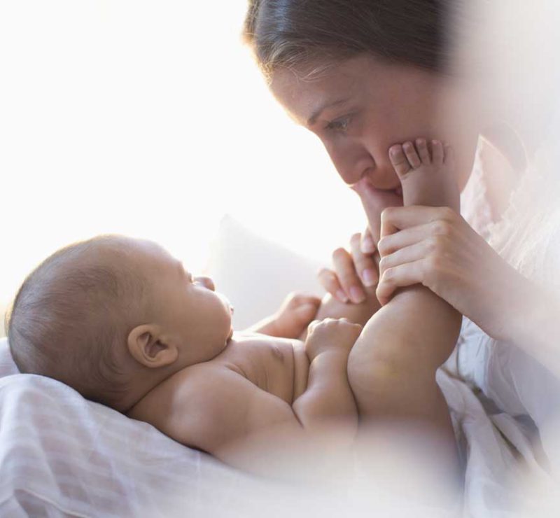 baby feet mother kissing infantsee