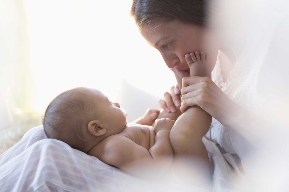 baby feet mother kissing infantsee